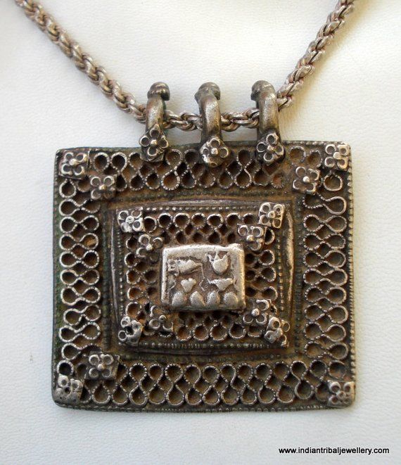 VINTAGE ANTIQUE COLLECTIBLE TRIBAL OLD SILVER PENDANT WITH CHAIN NECKLACE FROM RAJASTHAN INDIA. NICE HANDMADE DESIGN GREAT PIECE FOR ETHNIC JEWELRY COLLECTOR OR FOR TRIBAL STYLE BELLY DANCE. SUBJECT OF THIS AMULET IS HINDU GODDESS LAXMI (GODDES OF WELTH) AND LORD GANESHA (GOD OF MIND AND LUCK).Note - god image is much worn see picture carefully for more detail.chain Length - 60 cm(23.6")we can adjust the length.Pendant size - 7.5/6.8 cm(2.95/2.67")Weight - 100.5 gramsMaterial - Good silver & Antique Finish Temple Necklace For Festivals, Antique Hallmarked Temple Necklace For Festivals, Festival Antique Finish Temple Necklace Gift, Festive Silver Filigree Jewelry, Traditional Rectangular Necklace For Festivals, Ornate Jewelry For Navratri With Intricate Design, Traditional Jewelry With Antique Finish For Gift, Ornate Oxidized Necklace For Festivals, Ornate Antique Finish Jewelry For Festivals