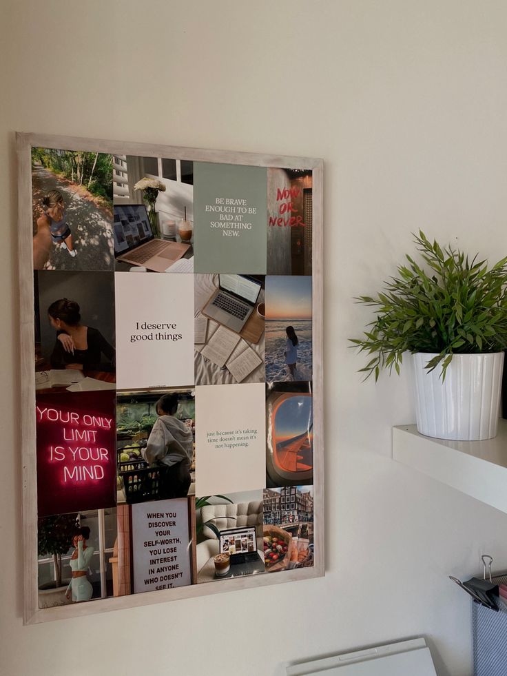 a white toilet sitting in a bathroom next to a wall mounted poster with pictures on it