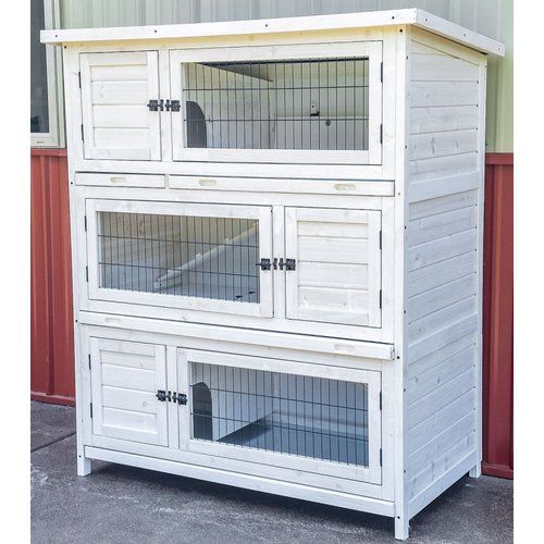 a large white wooden cabinet with two windows