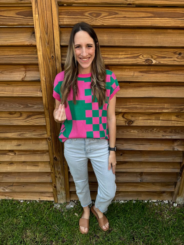 Get ready to stand out with our Green & Pink Checker Knitted Top! This retro-inspired short sleeve sweater is perfect for adding a pop of color and pattern to any outfit. Keep it cool and comfortable with our unique knitted design. (Sweater weather just got a whole lot cuter.) Color: Green & Pink Model is 5'6", 125 lbs, and is wearing a small! True to Size. Material: 50% Vicose, 28% Polyester, 22% Nylon