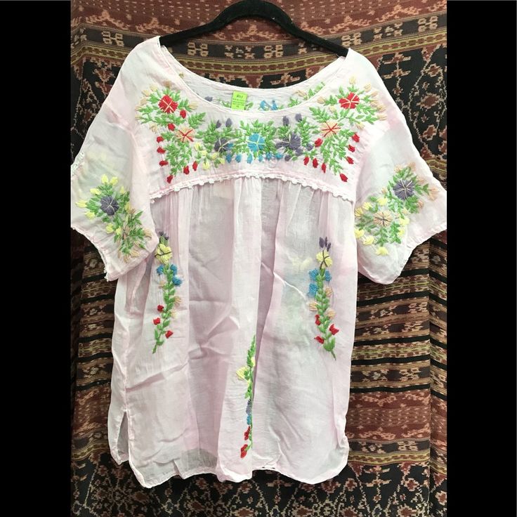 Cotton Short Sleeve Spring Bohemian Crew Neck Blouse, Bohemian Embroidered Relaxed Fit Blouse, Spring Crew Neck Blouse With Embroidered Hem, Casual Embroidered Spring Tunic Top, Multicolor Embroidered Peasant Top For Beach, Casual Spring Blouse With Embroidered Neckline, Embroidered Bohemian Peasant Top With Relaxed Fit, Bohemian Crew Neck Blouse For Vacation, Spring Bohemian Blouse With Embroidered Hem