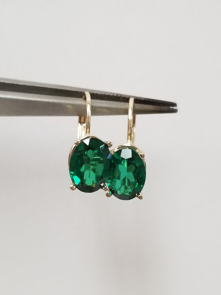 "Thanks for shopping our vintage estate store. We tend to sell well below wholesale and truly hope you enjoy all of our items. Many of the items are one of a kind, so please enjoy scrolling through the pictures and hopefully something will catch your eye. Brown spots are from reflections or camera. Nice estate 14k yellow gold created 3ct emerald lever back earrings. Gems are testing natural, but the are created. Retail $399 on sale $239 Length: 5/8\" 12mm Width: 1/4\" 5.5mm Weight: 1.78 grams Ca Classic Green Clip-on Earrings, Classic Emerald Earrings For Anniversary, Classic Emerald Earrings For Formal Occasions, Classic Formal Emerald Earrings, Vintage Emerald Earrings For Anniversary, Classic Lever Back Jewelry For Anniversary, Classic May Birthstone Earrings As Gift, Classic 14k Gold Earrings For May Birthstone, Vintage Gold Jewelry Aaa Quality