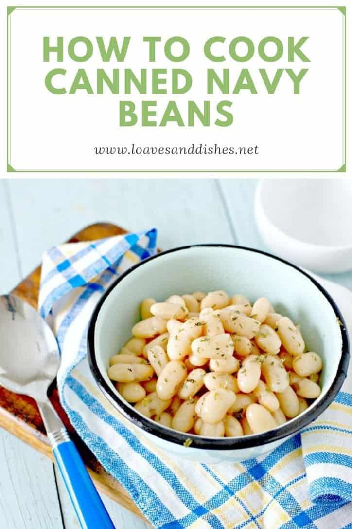 a white bowl filled with beans on top of a blue and white checkered cloth