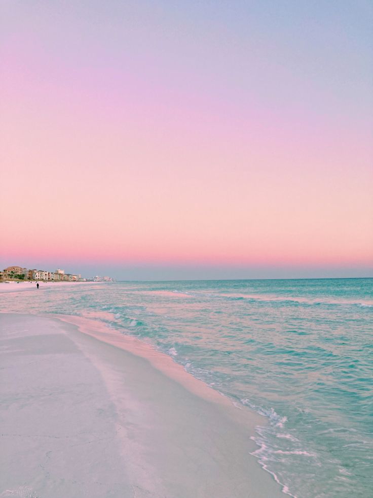 the beach is clean and empty at sunset