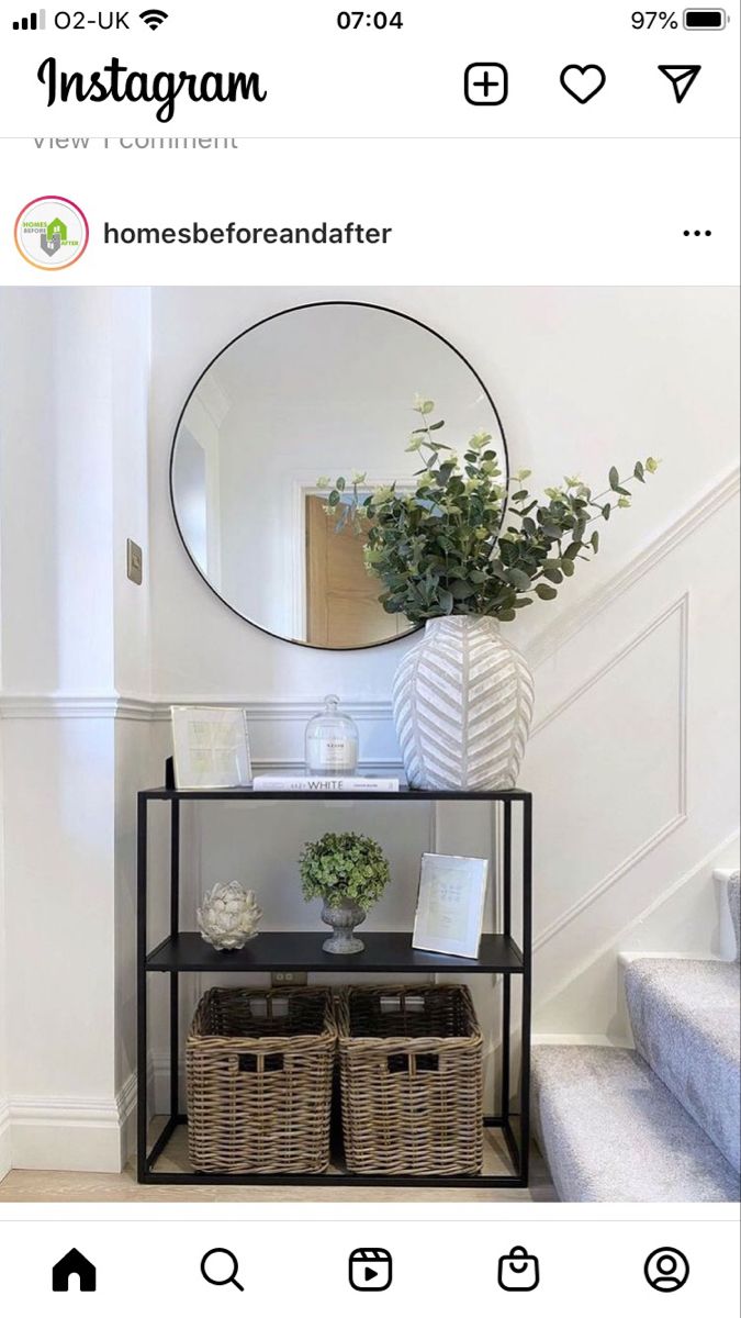 an instagram page with a mirror and some baskets on the shelf next to it