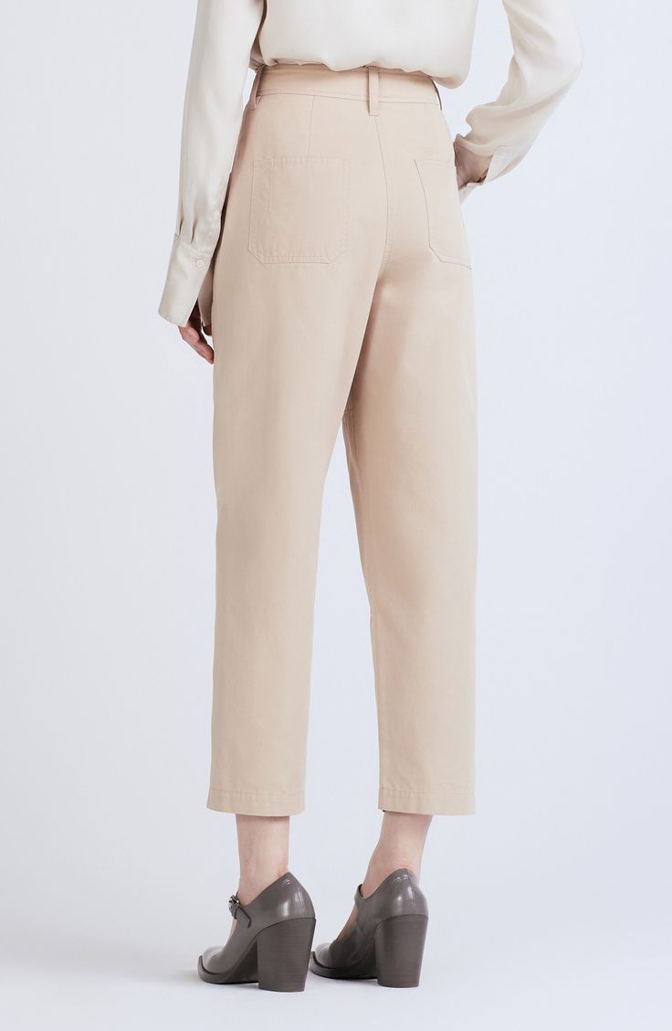 Rivet, feather-edge belt loops and patch pockets define these utilitarian pants featuring an ankle-cropped length cut from a supersoft cotton-based blend. Zip fly with double button closure 51% cotton, 49% tencel Dry clean Imported High-waisted Workwear Bottoms With Flap Pockets, High-waisted Pants With Flap Pockets For Work, High-waisted Chinos With Pockets For Work, Beige Chinos With Pockets For Workwear, Beige Ankle-length Cargo Pants For Work, Beige Workwear Bottoms With Patch Pockets, Workwear Chinos With Patch Pockets, Relaxed Fit Cropped Leg Chinos For Work, Spring Workwear Pants With Flap Pockets