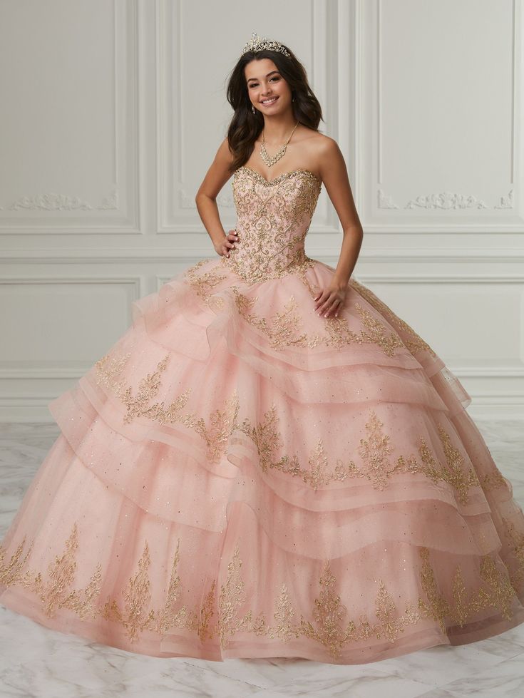 You'll love twirling around in this lace applique long strapless dress with A-line layered skirt by House of Wu Quinceanera Collection 26989. Made out of tulle, this beautiful strapless ball gown features a sweetheart bodice adorned with lace appliques, detachable lantern long sleeves with appliques details edges, triple layers of tulle and lace finished with horsehair. This look is finished with a lace-up corset back and a sweep train. House of Wu Quinceanera Collection Fall 2021 Style Number: Big Puffy Dresses, Quinceanera Collection, Military Ball Dresses, Quince Dress, Puffy Dresses, Quinceanera Dress, 16 Dresses, Illusion Dress, Sweetheart Dress