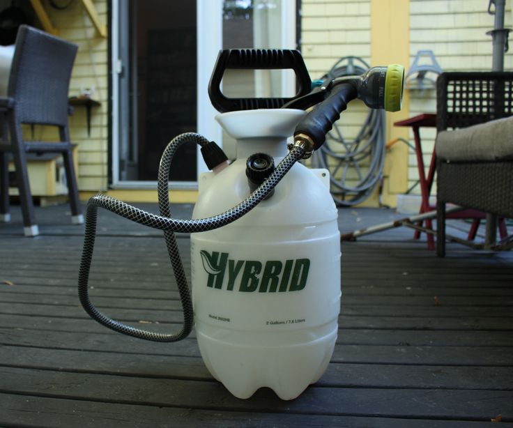 a white jug sitting on top of a wooden deck