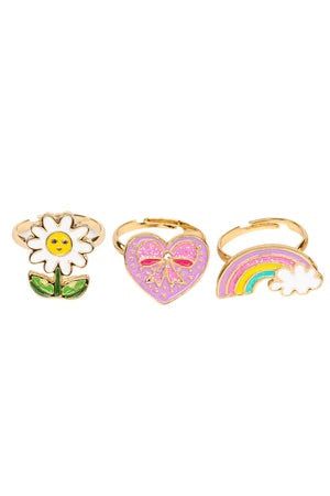 three rings with different designs on them and one has a flower, rainbow, and heart