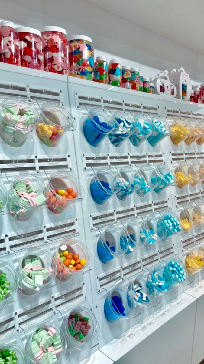 the shelves are filled with many different types of candies