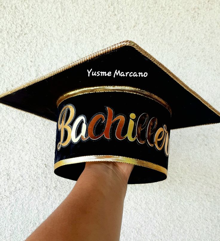 a person wearing a graduation cap with the word bachelor written on it