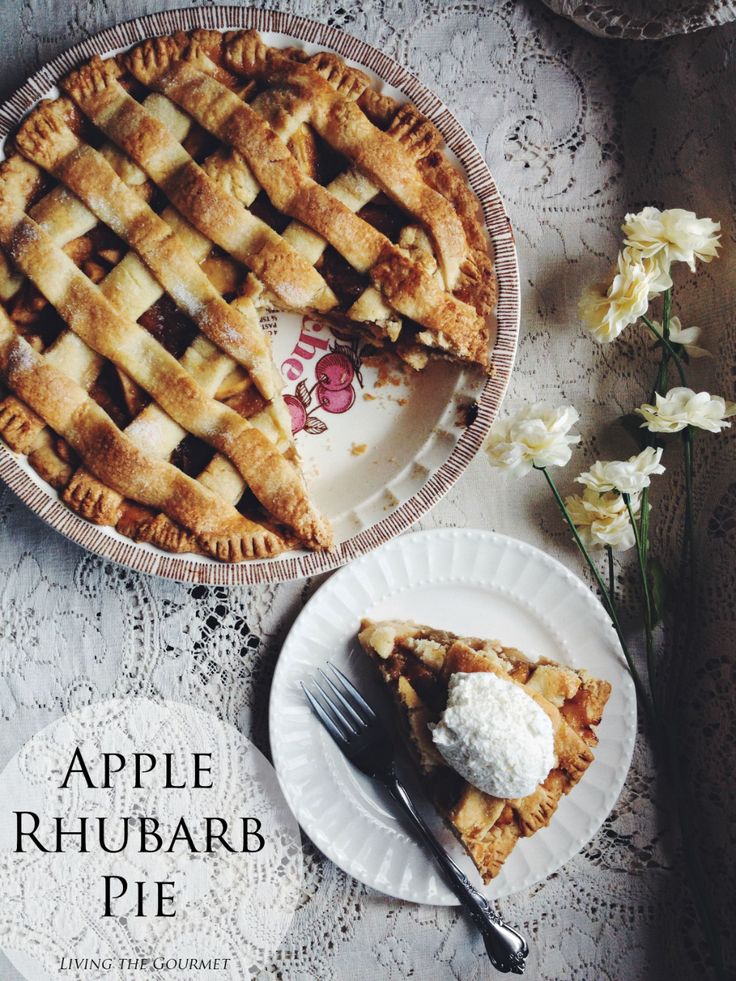 an apple rhubarb pie on a plate with a fork next to it