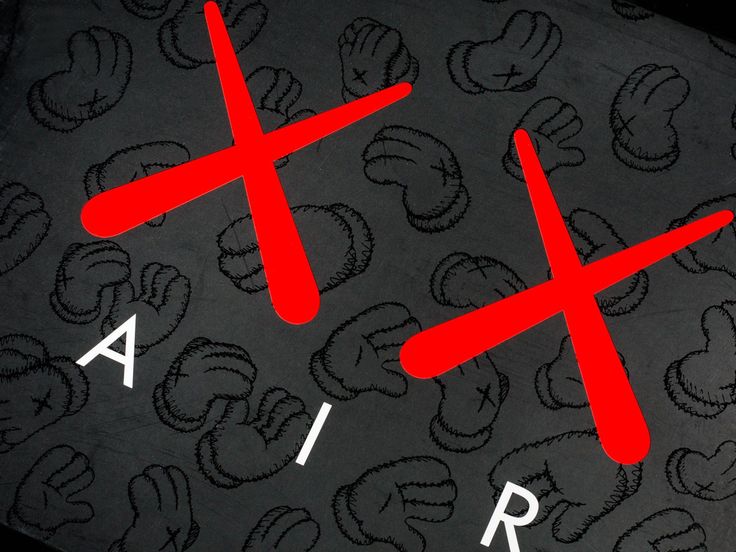 two red crosses are on the back of a black cloth with white letters that read air