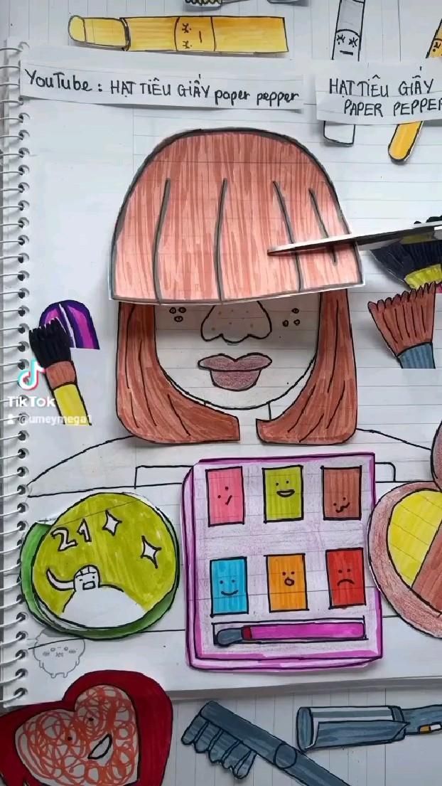 a child's drawing of a girl holding a brush, palette and cupcakes