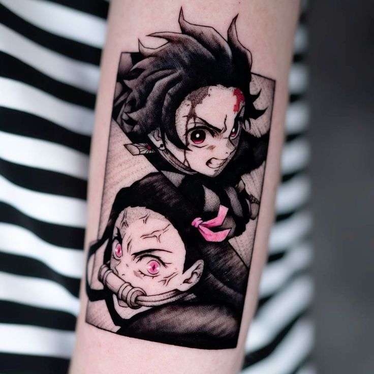 a woman's arm with an image of two anime characters on it, one is black and the other is red