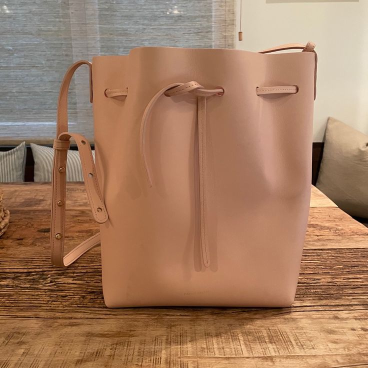 New With Tags! Pale Pink All Leather Mansur Gavriel Bucket Bag. Very Sweet, Understated Shade Of Pink. Comes With A Detachable Matching Mini Pouch And Dust Bag. Product Details: Made In Italy Adjustable And Detachable Shoulder Strap Drawstring Opening Height: 12.5in / 31.5cm Length: 9.75in / 25cm Depth: 7.5in / 19cm Strap Drop: 19in / 48cm Pink Leather Bucket Bag For Daily Use, Pink Leather Rectangular Bucket Bag, Pink Rectangular Leather Bucket Bag, Rectangular Pink Leather Bucket Bag, Pink Leather Shoulder Bag With Dust Bag, Pink Leather Bucket Bag With Removable Pouch, Luxury Pink Bucket Bag For Everyday, Elegant Pink Pouch Bucket Bag, Pink Bucket Bag With Dust Bag Included