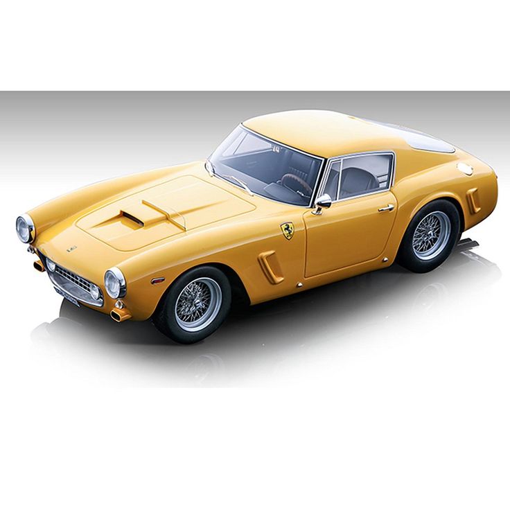 an old yellow sports car on a white background