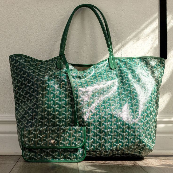 Goyard Saint Louis Green GM Tote Handbag Brand Goyard Model Saint Louis Green GM Style Tote Department Ladies Condition This bag is in fair condition. The outside of the bag has no visible marks or scuffs. The inside of the bag has some yellow and brown stains. The inside of the smaller pouch is in good condition and there are no visible marks. Please refer to pictures for more details. This handbag comes with dustbag Dimensions 34 cm x 40 cm x 20 cm Closure no closure Handle/Strap color Green Lining Material Fabric Exterior Material Leather Hardware Color Silver SKU BDDD Goyard Saint Louis, Goyard Tote, Handbag Model, Green Tote, Leather Hardware, Small Pouches, Tote Handbag, Saint Louis, Branded Handbags