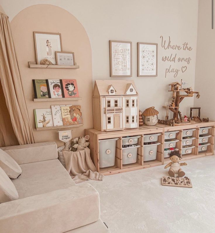 a living room filled with furniture and pictures on the wall