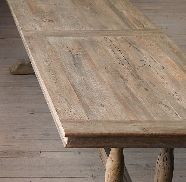 a wooden table sitting on top of a hard wood floor