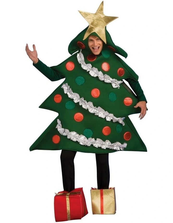 a man in a christmas tree costume standing with his arms out and hands on his hips