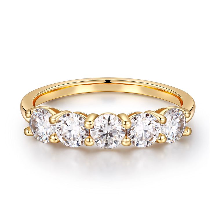 three stone ring in yellow gold with four stones on each side and two diamonds at the bottom