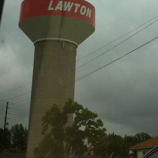 a water tower with the word lawton on it