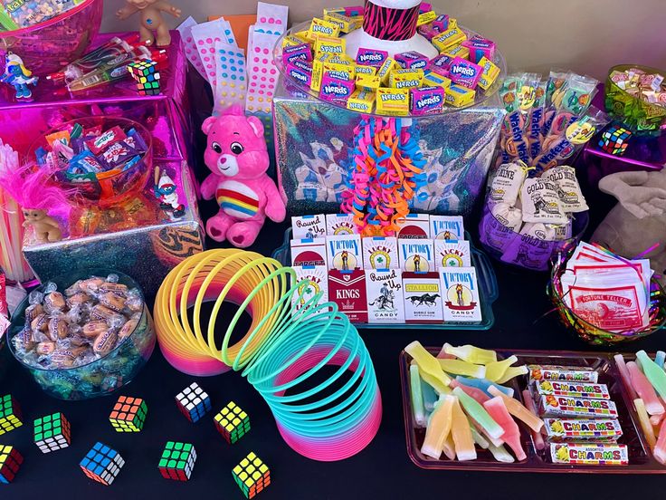 a table topped with lots of toys and candy