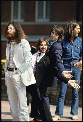 the beatles are posing for a photo together