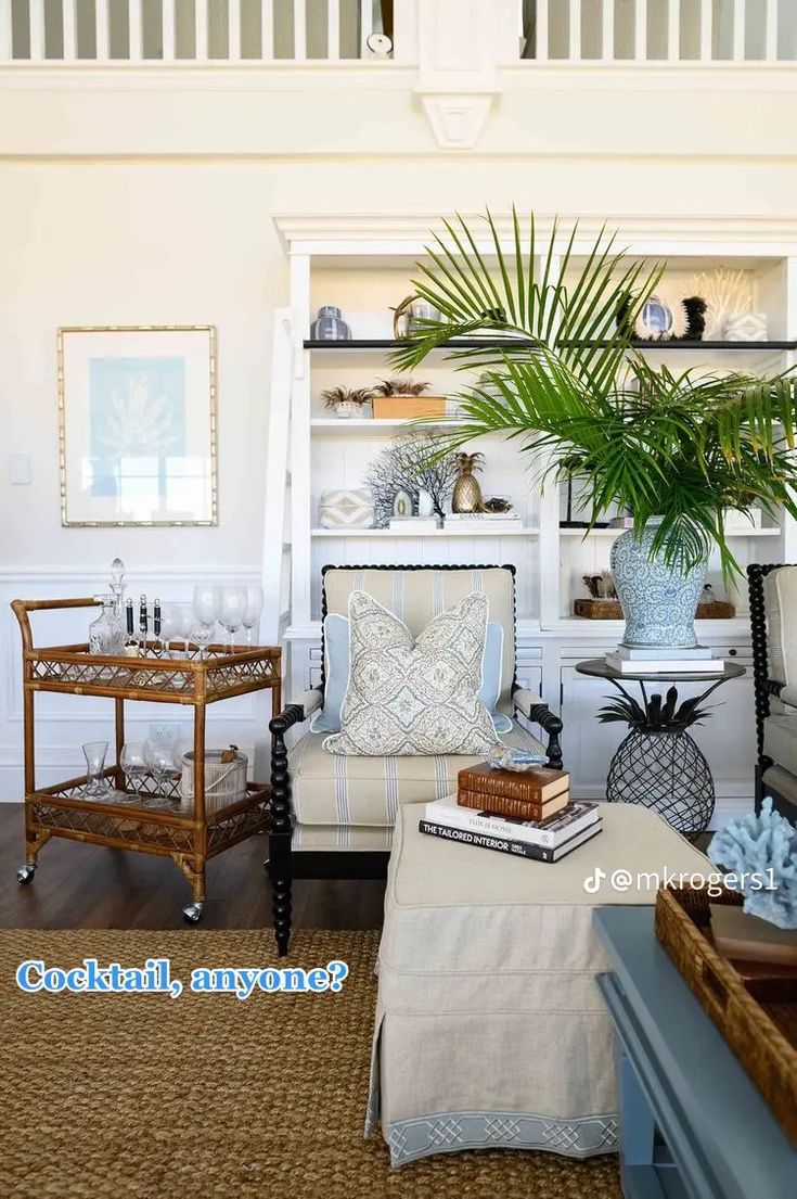 a living room filled with furniture and a potted plant on top of a table