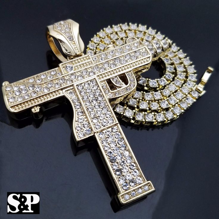 Hip Hop Celebrity Style Brand New Usa Seller Product Description 1 Row Diamond Necklace : Chain Length : 18" Chain Width : 3mm Color: Gold, White Gold Plated Lab Simulated Diamonds Machine Gun Pendant : Gold, White Gold Plated Size Of Pendant: 1.75" & 1.85" Lab Diamonds On Pendant High Quality And Polished. White Iced Out Chain Necklace, White Cuban Link Chain Jewelry, White Cuban Link Necklaces With Gold Chain, White Cuban Link Chain Necklace With Adjustable Chain, White Box Chain Round Necklace, White Round Box Chain Necklace, White Box Chain Necklace With Round Pendant, White Metal Jewelry With Box Chain, Tiger Pendant