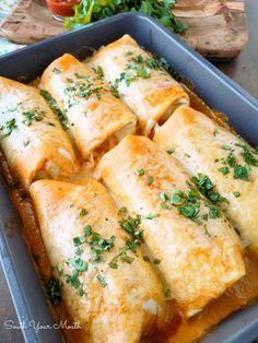 an enchilada casserole in a baking dish with text overlay