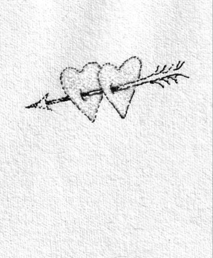 two hearts pierced in the middle with an arrow on it's side, drawn by hand