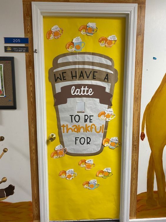 a door decorated with stickers that says we have a latte to be thanksgiving top