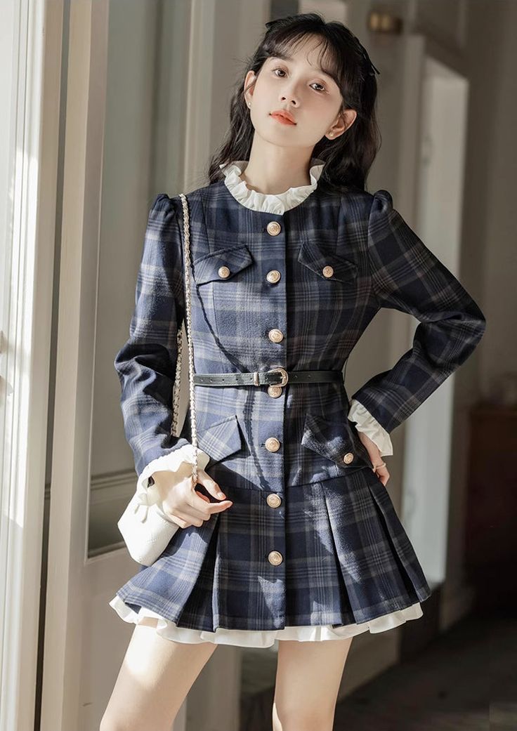 This preppy mini dress features a modest high neckline, button-down closure, faux pockets at the chest and hips, and frilly cuffs. Its shoulders are slightly puffed for an exquisite sense, and the skirt is pleated at the hem with a longer lining to produce an underskirt effect. A belt is included to cinch the waist. S: 32" chest, 25" waist, 30" lengthM: 33.5" chest, 26.5" waist, 30.5" lengthL: 35" chest, 28" waist, 31" lengthXL: 36.5" chest, 29.5" waist, 31.5" length Fall Dresses With Button Closure For Office Wear, Office Lady Dresses With Buttons For Fall, Fall Office Lady Dresses With Buttons, Fall Office Style Dresses With Buttons, Preppy Mini Dress For Work, Preppy Dresses For Fall Workwear, Preppy Long Sleeve Dresses For Fall, Preppy Fitted Dress For Fall, Preppy Mini Dress For Fall