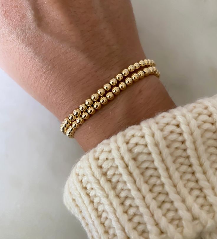 Our gold bead bracelet is essential to any bracelet stack. Made from top-quality 14k gold-filled beads on durable stretch cord. Made to last in your collection for years. 100% water-proof. Sold in a quantity of one Gold Bead Bracelet, Gold Beaded Bracelet, Gold Bead Bracelets, Minimalist Bracelet, Handmade Rings, Gold Filled Jewelry, Polish Jewelry, Bracelet Stack, Bead Bracelet