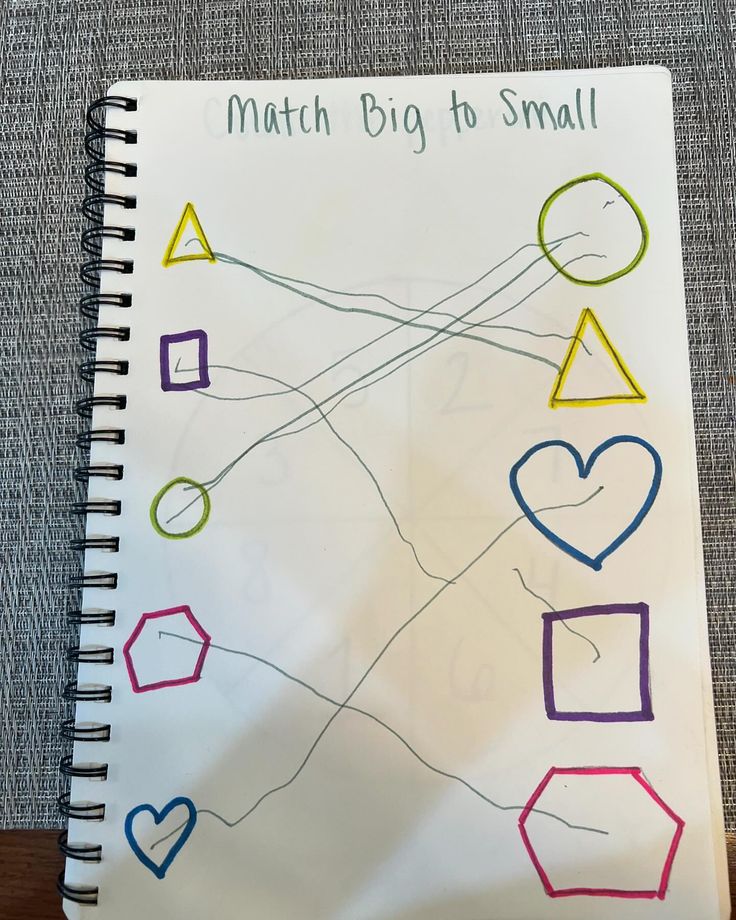 a notebook with some drawings on it and the words match big to small written in different colors