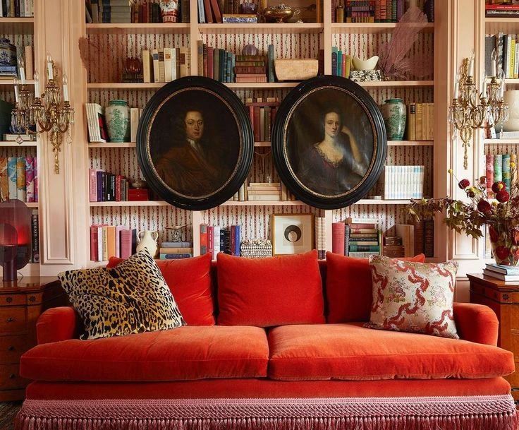 a living room filled with furniture and bookshelves covered in lots of bookcases