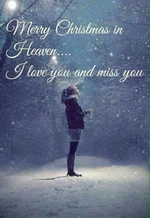 a woman standing in the snow with her arms around her head and text merry christmas heaven i love you and miss you