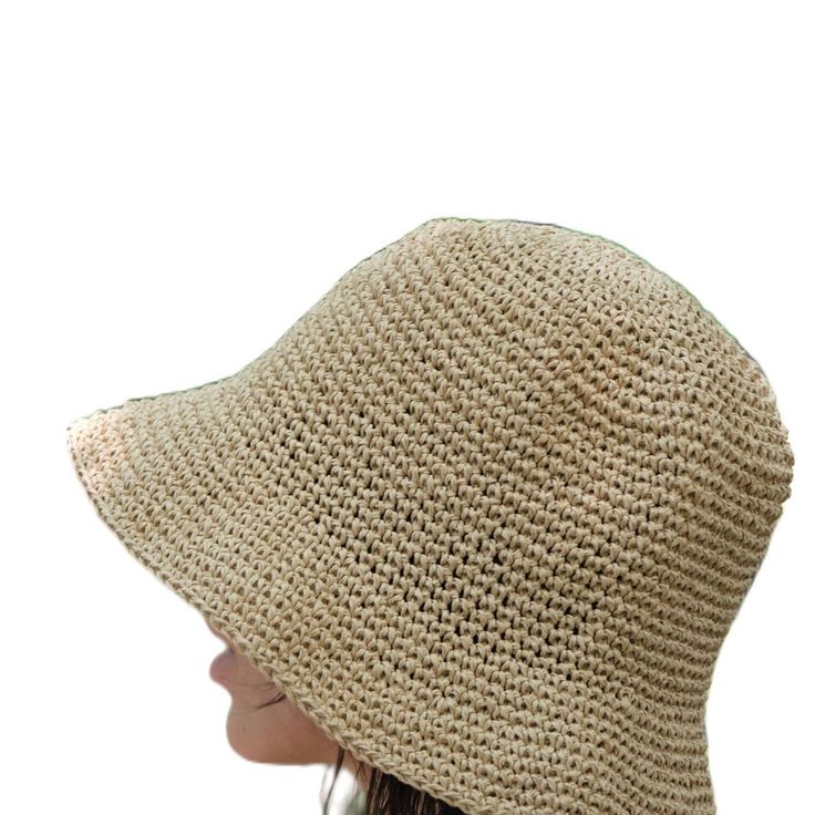 This hat is 100% handmade and crafted from raffia yarn. Raffia yarn is a natural and durable material, ensuring the hat's longevity. The wide brim of the hat is perfect for sun protection and offers a stylish look. This beige hat stands out with its simple and elegant design. It is an excellent accessory for both everyday use and outdoor activities like the beach. Its comfortable and lightweight structure ensures easy and prolonged wear. Raffia. You can store this hat, knitted from raffia rope, in a breathable cloth bag, protect it from fire and heat, and wipe the stains with a clean damp cloth. Beige Straw Panama Hat With Curved Brim, Eco-friendly Toquilla Straw Hat, Cream Straw Hat With Short Brim, Natural Woven Wide Brim Bucket Hat, Natural Straw Bucket Hat With Flat Brim, Wide Brim Natural Woven Bucket Hat, Wide Brim Woven Bucket Hat In Natural, Beige Toquilla Straw Hat With Short Brim, Woven Straw Bucket Hat With Flat Brim