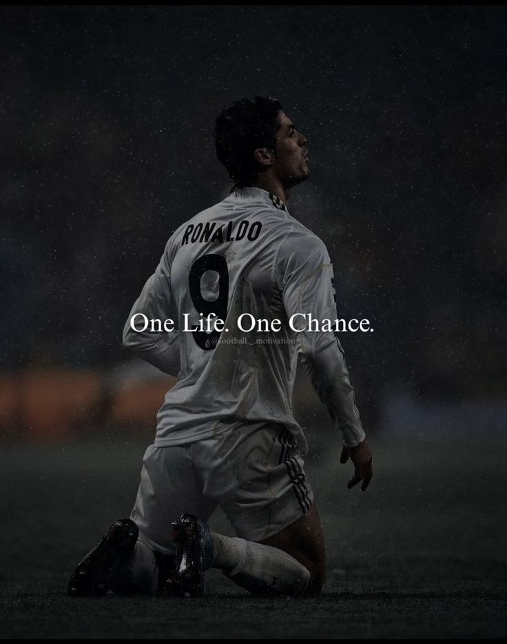 a soccer player with the words one life, one chance on his chest and knees