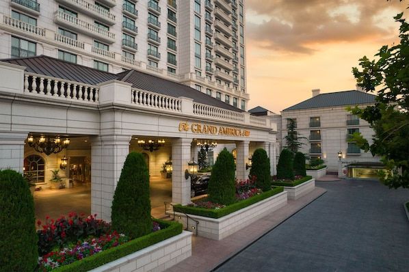 the grand america hotel and casino in las vegas, nv is pictured at sunset