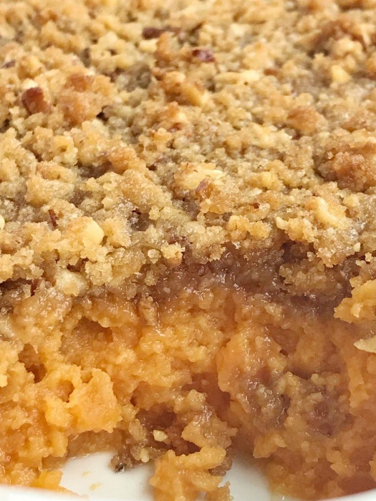 a close up of a pie with crumbs on it's crusty topping