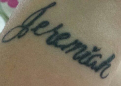 a woman's arm with the word grandma written in cursive writing