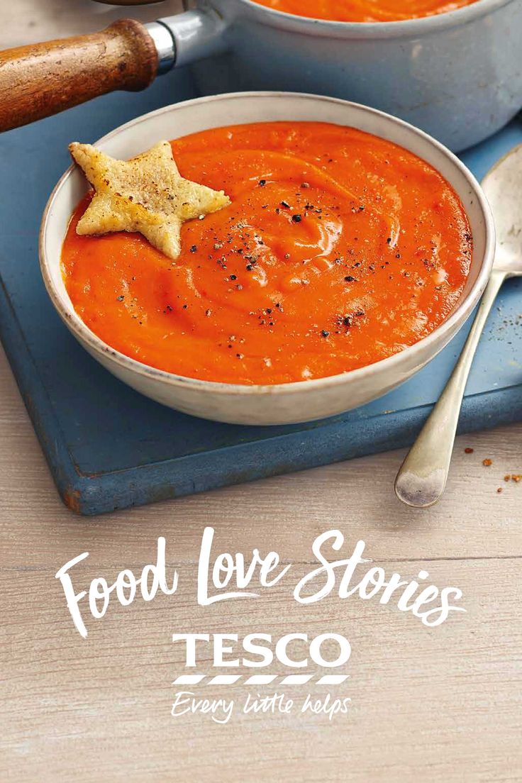 two bowls of food on top of a blue cutting board with a star shaped cookie