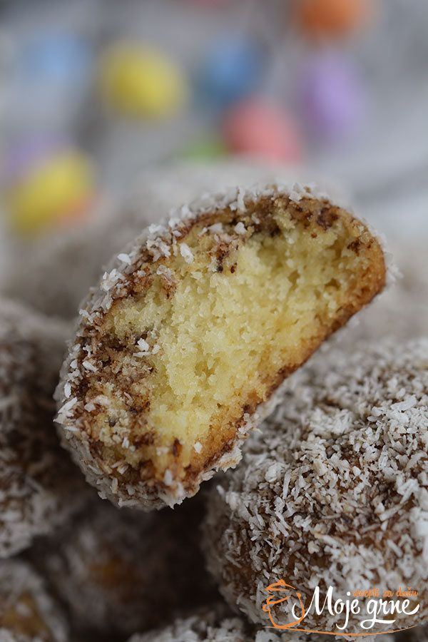 a close up of some type of dessert with powdered sugar on top and one half eaten