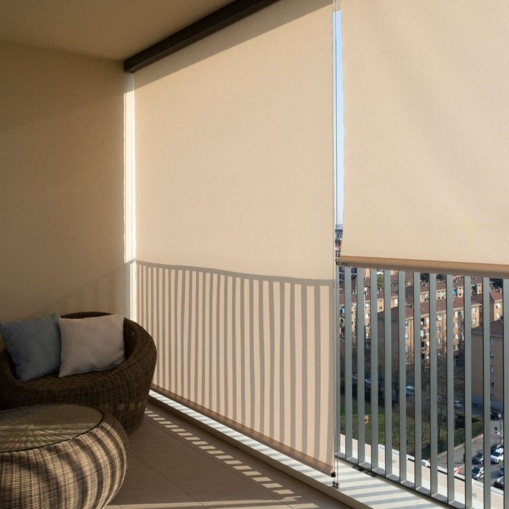 the sun is shining through the blinds on this balcony