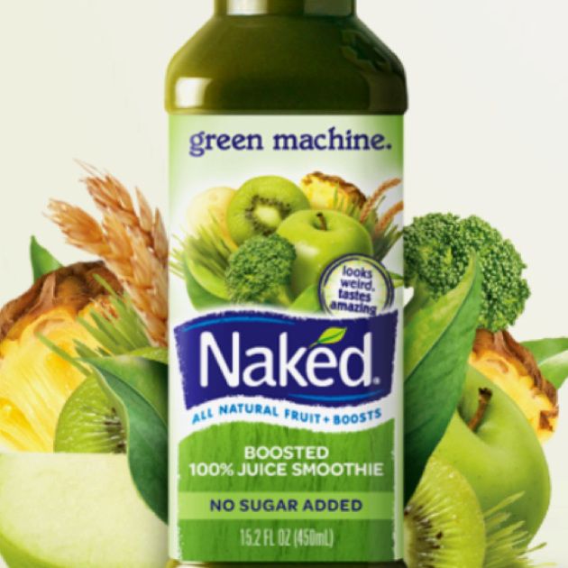 a bottle of naked juice surrounded by fruit and vegetables