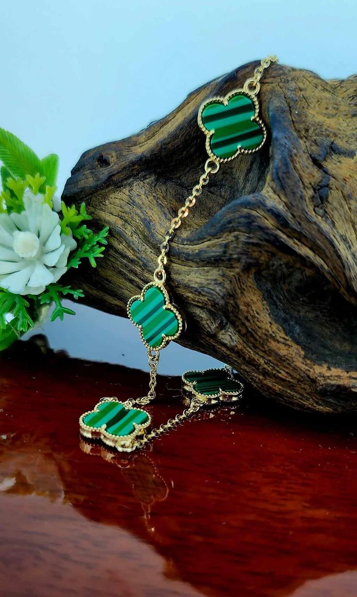 Green Trébol Bracelet in 14k Gold this item is ideal for women perfect for everyday wear it comes in 8 inches long, giftbox included.  Pulsera de trebol verde en oro 14k ideal para mujer perfecto para uso de todos los dias esta pulsera viene en 8 pulgadas de largo, incluimos una cajita de regalo. Luxury Green 14k Gold Bracelets, Elegant Green Gold-plated Bracelet, Luxury Green Gold Bracelet As A Gift, Luxury Green Gold Bracelet For Gift, Elegant Green Gold Bracelet Gift, Four Leaf Clover Bracelet, Green Clover, Clover Bracelet, Clover Green