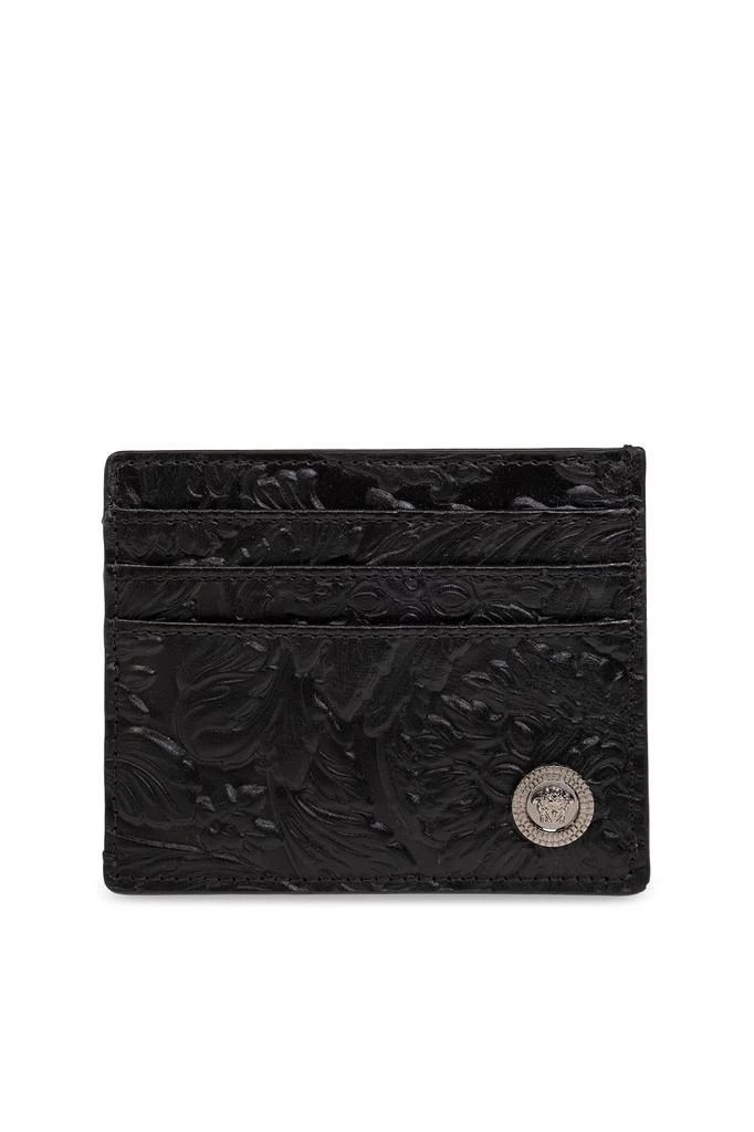 Black wallet from Versace. Made of calf leather, this design features an embossed Barocco pattern, Medusa '95 logo detail, six card slots and an internal pocket. Height: 8cm Width: 10cm Designer Business Wallets With Embossed Logo, Designer Wallets With Embossed Logo For Business, Classic Bifold Wallet With Engraved Logo, Formal Rectangular Card Holder With Embossed Logo, Black Luxury Card Holder With Engraved Logo, Luxury Black Card Holder With Engraved Logo, Classic Embossed Wallets For Formal Occasions, Rectangular Card Holder With Embossed Logo For Formal Use, Designer Formal Wallets With Embossed Logo